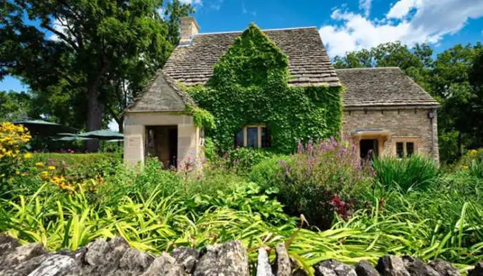 A quaint 17th-century English-style stone cottage nestled in Greenfield Village, Michigan. A quaint 17th-century English-style stone cottage nestled in Greenfield Village, Michigan.