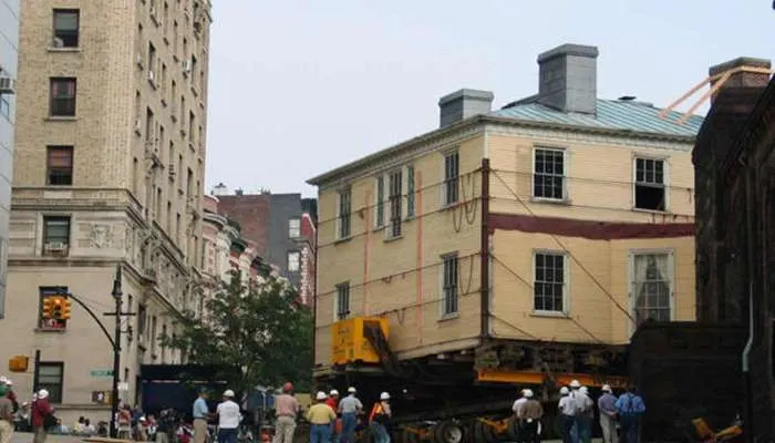The historic Hamilton Grange house being elevated on hydraulic jacks during its move in New York City. The historic Hamilton Grange house being elevated on hydraulic jacks during its move in New York City.