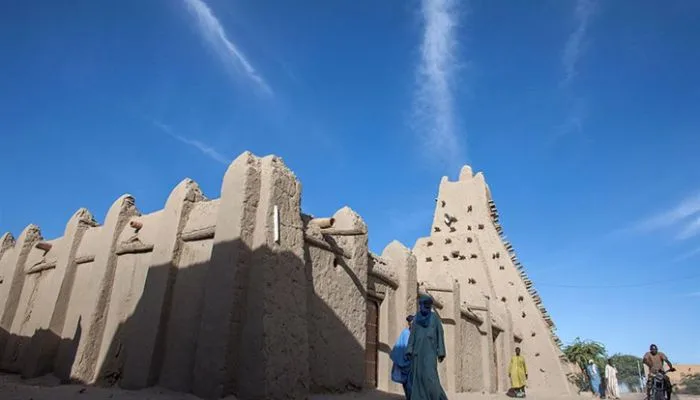The ancient mud-brick architecture of the Mosque of Sankore in Timbuktu, a remnant of the Mali Empire. The ancient mud-brick architecture of the Mosque of Sankore in Timbuktu, a remnant of the Mali Empire.